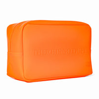 Skin Rocks by Caroline Hirons | Bright orange travel pouch with 'THERE IS NO DUPE' embossed text