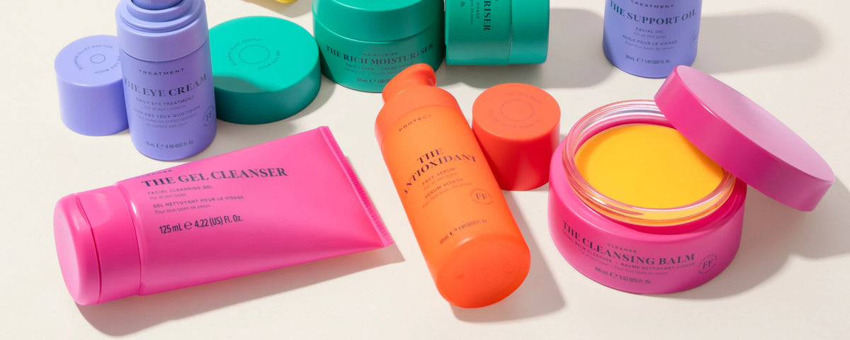 Skin Rocks by Caroline Hirons | Colorful skincare products including cleanser, moisturizer, and serum