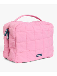 Skin Rocks by Caroline Hirons | Pink quilted travel makeup bag with handle and branded tags