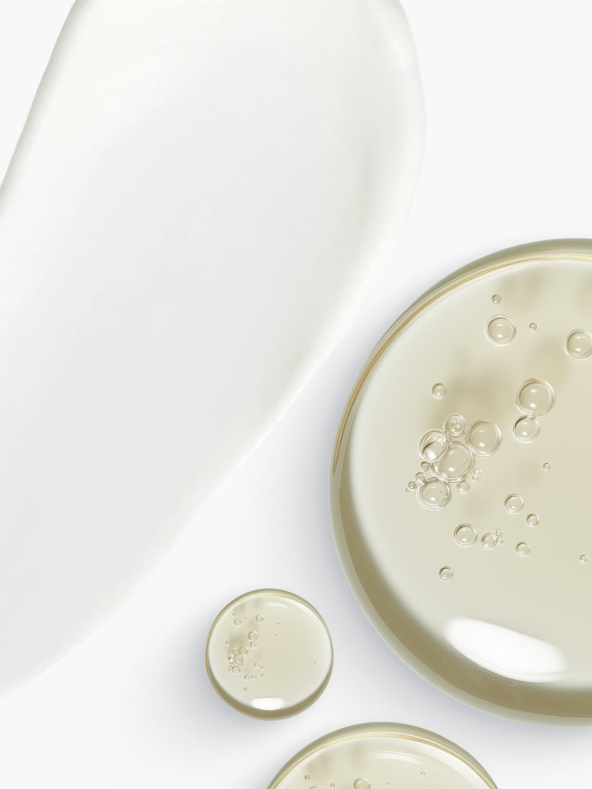 Skin Rocks by Caroline Hirons | Textures of creamy white moisturizer and clear facial serums.