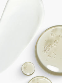 Skin Rocks by Caroline Hirons | Textures of creamy white moisturizer and clear facial serums.