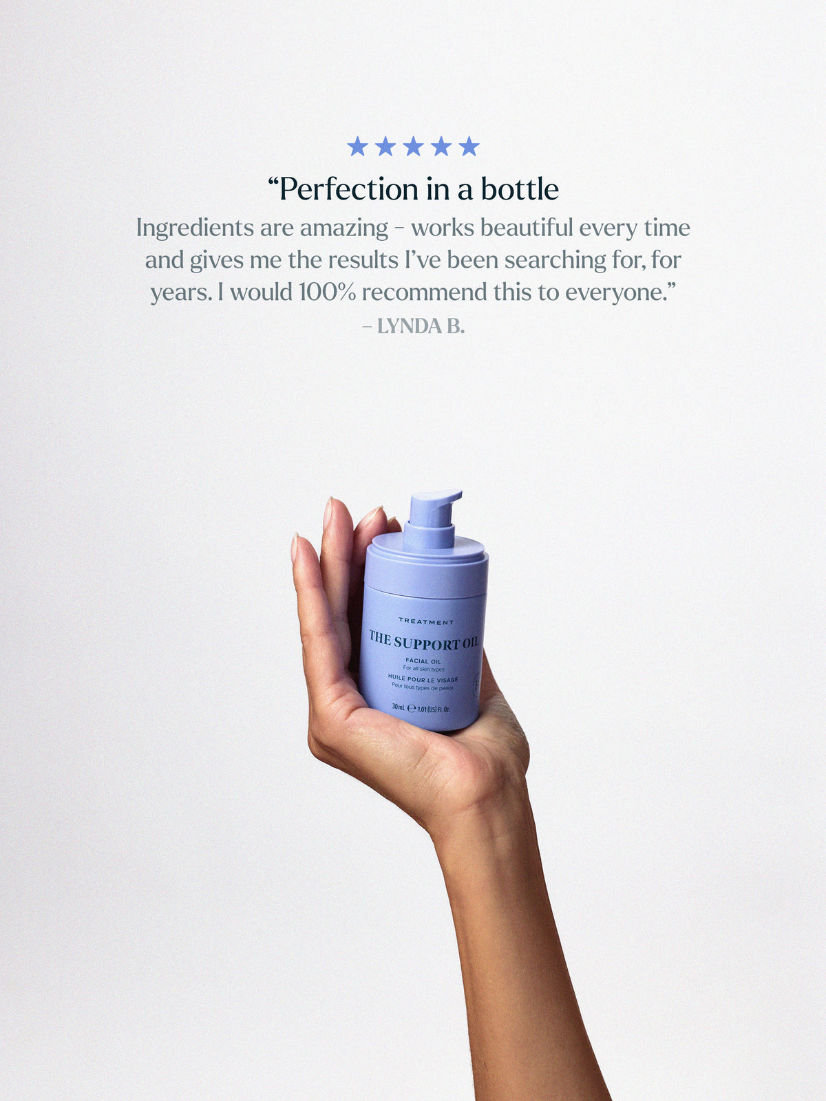 Skin Rocks by Caroline Hirons | The Support Oil facial oil held in a hand with a customer review