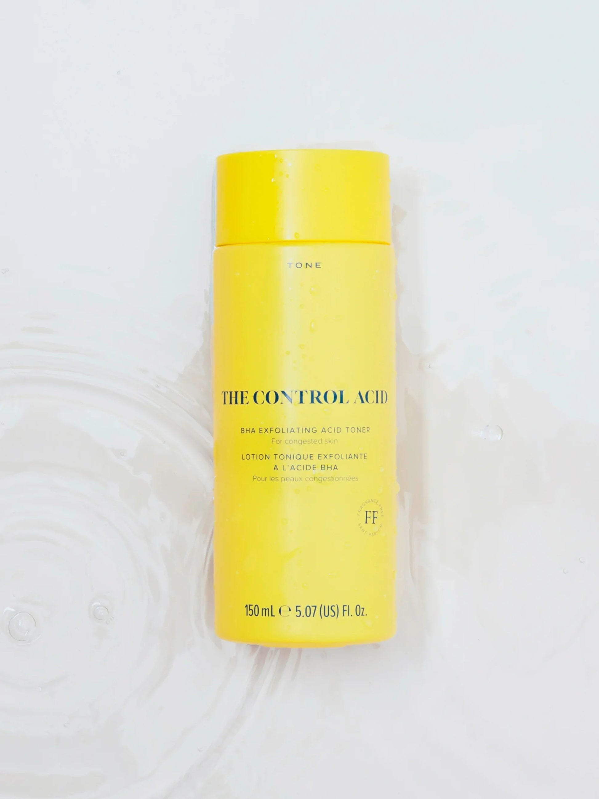 Skin Rocks by Caroline Hirons | The Control Acid BHA Exfoliating Toner for congested skin in yellow bottle