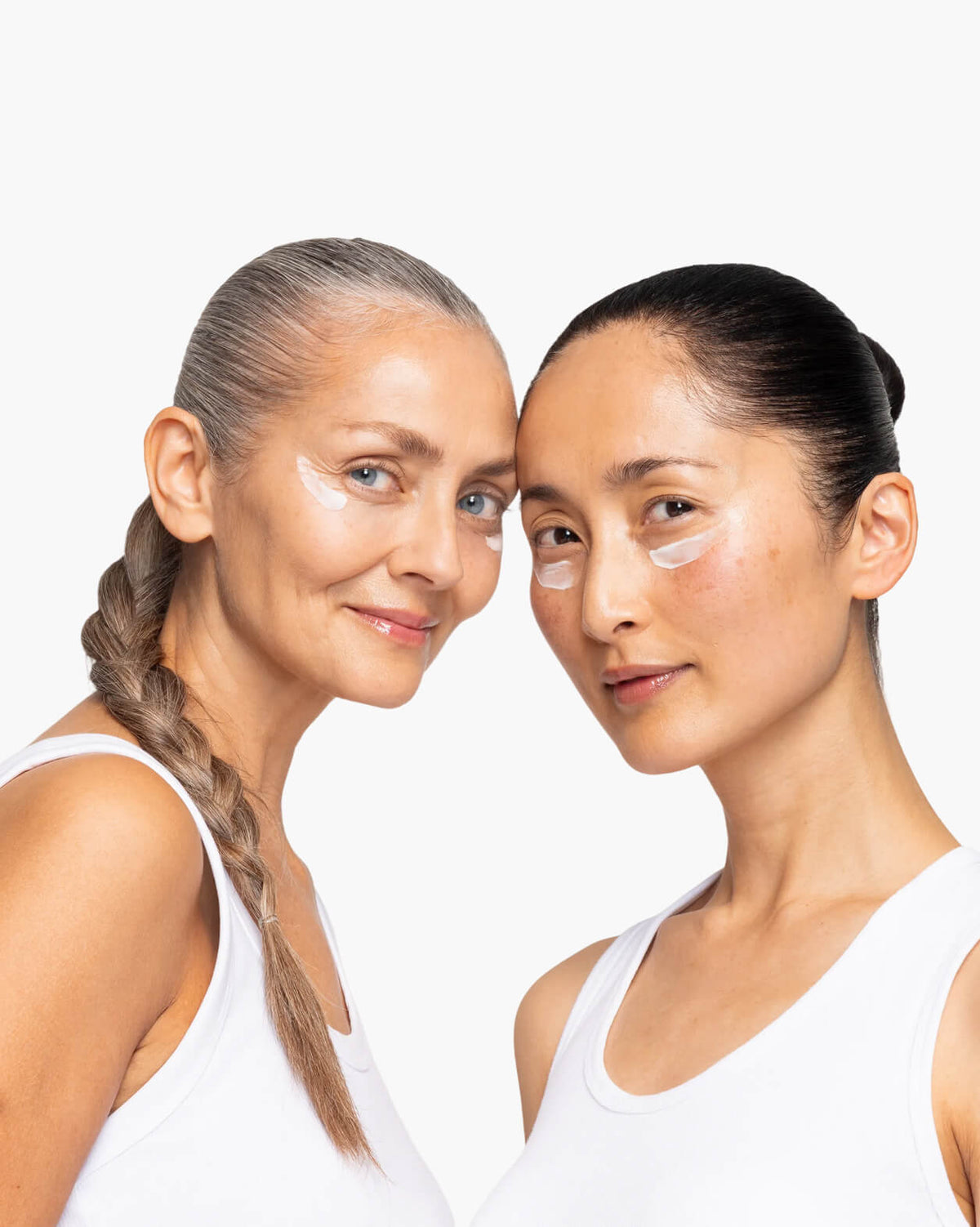 Skin Rocks by Caroline Hirons | Two women of different ages applying eye cream to their faces.