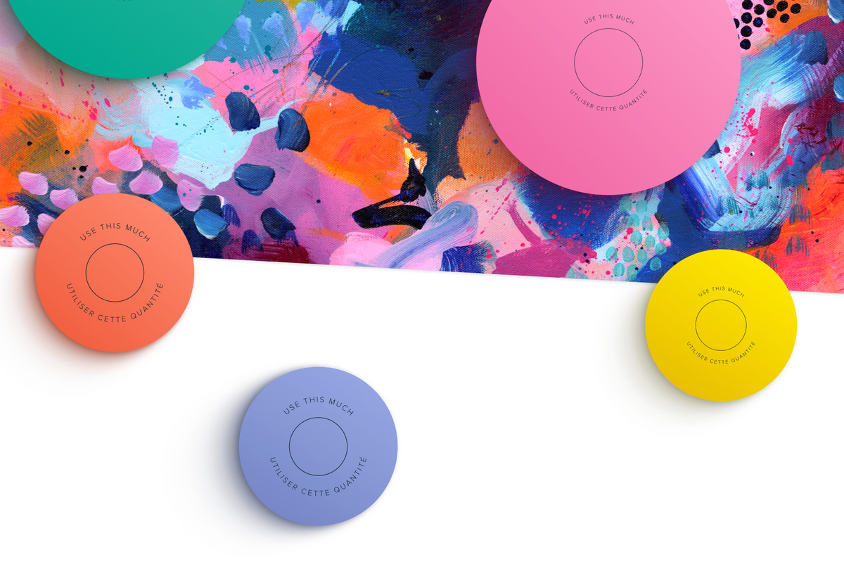 Skin Rocks by Caroline Hirons | Colorful circular product lids on an abstract painted background